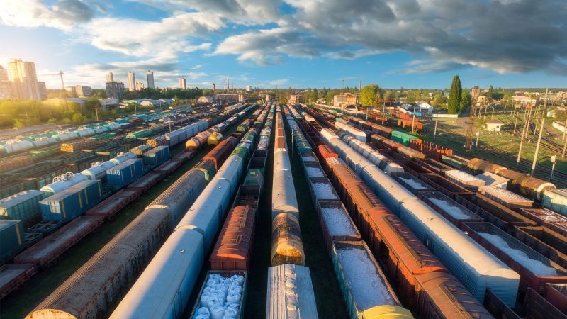 Drone view of freight trains at sunset