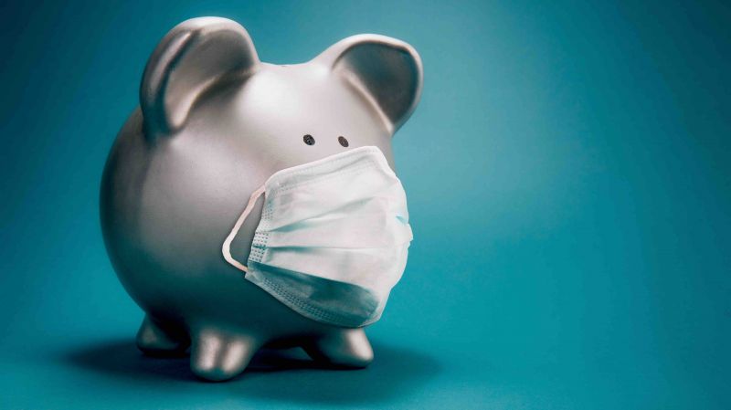 Piggy bank wearing a medical mask