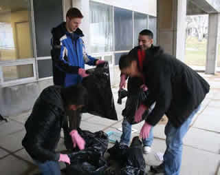Their parents may have been surprised: Commerce team voluntarily takes out the garbage as part of their recycling-in-residence experiment.