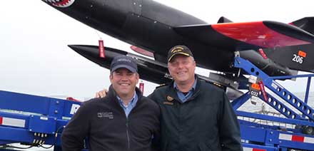 Spencer Fraser, left, with Cdr. Haydn Edmundson are all smiles as Hammerhead #206 is readied for its simulated attack on HMCS Winnipeg.