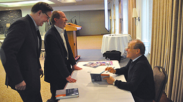 Julian shares a laugh while signing his book at the Calgary event