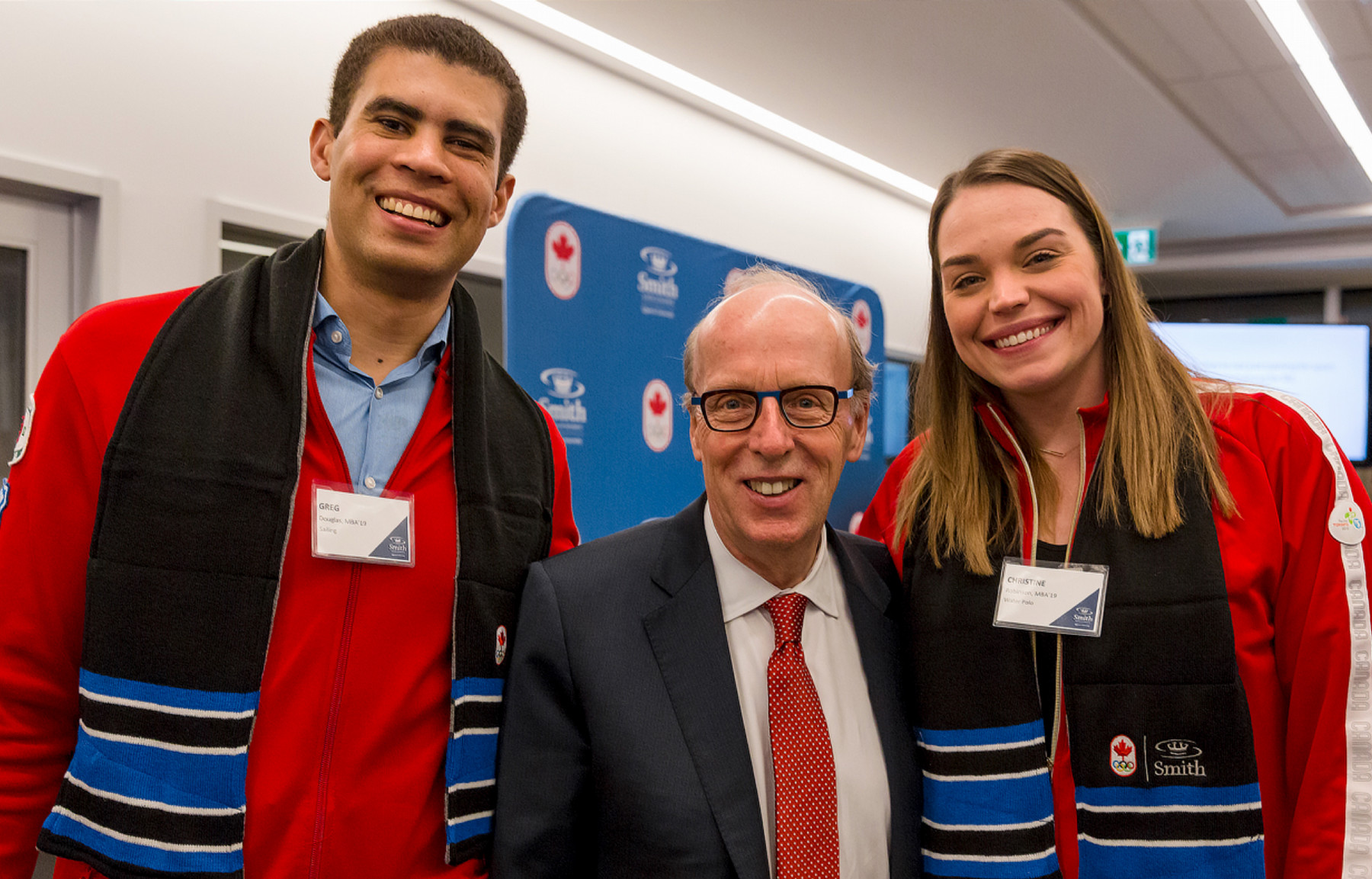 COC athletes Christine Robinson, MBA’19, (water polo) and Greg Douglas, MBA’19, (sailing) with Stephen Smith.