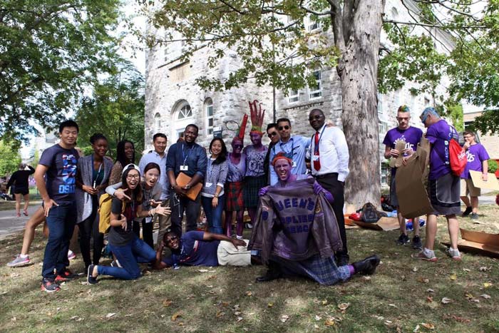 On a campus tour during their orientation, MEI students encounter engineering students in traditional Frosh Week attire. 