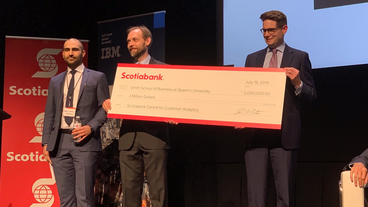 Hootan Kamran (left) and Mikhail Nediak (centre) accept cheque for renewed SCCA funding from Scotiabank.